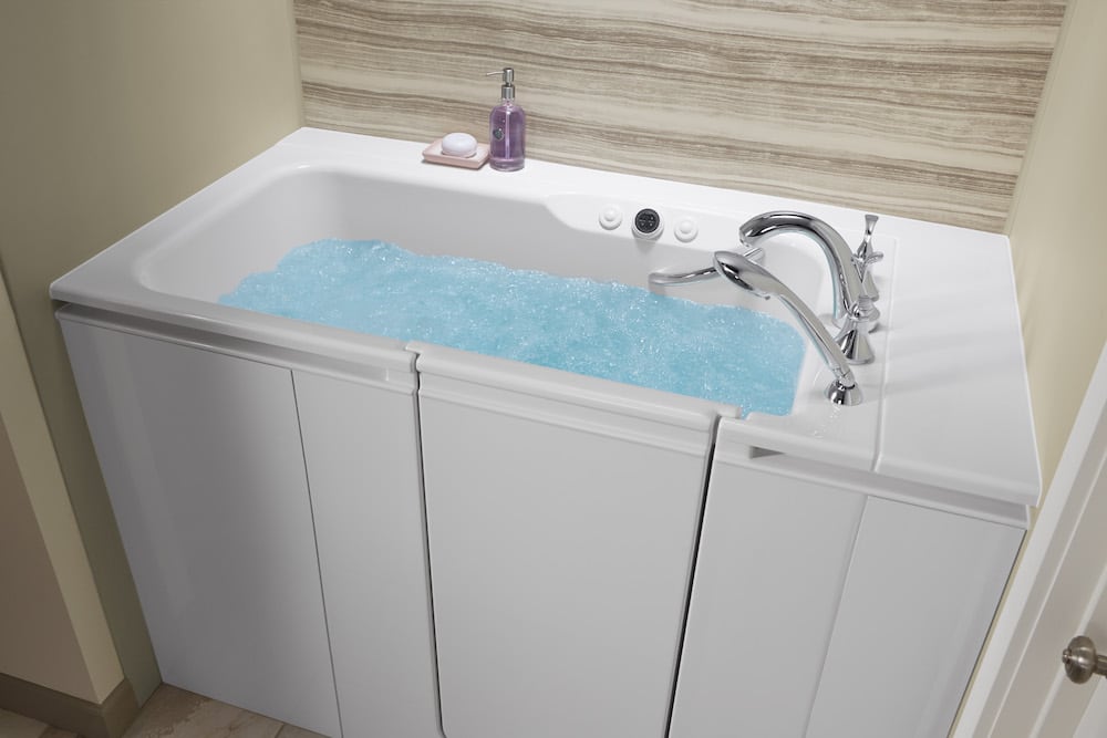 Walk-in tub filled with water.