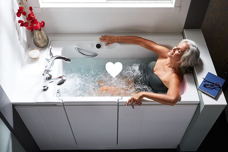 Woman relaxing in Kohler Walk-In Bath