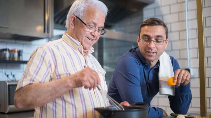 man cooking with father